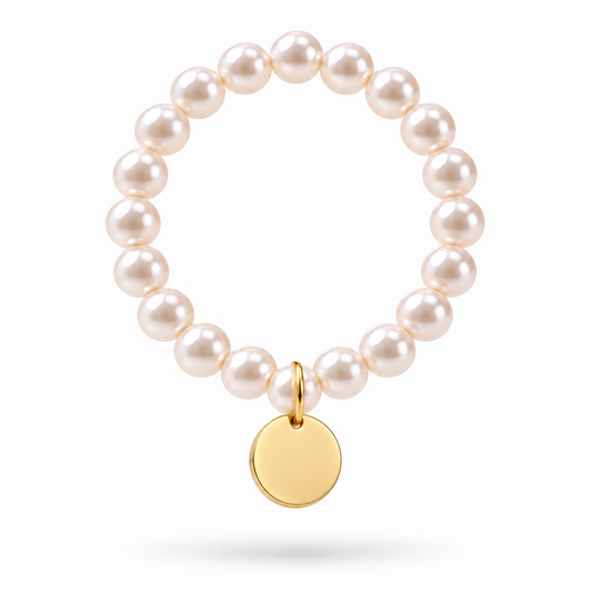 Circular Luna Pearl Bracelet hanging with gold charm and soft shadow
